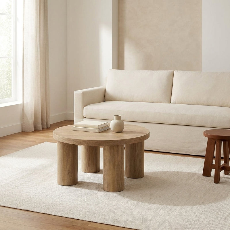 Kolvern Oak Pillar Coffee Table three quarter view in a Tloom living room