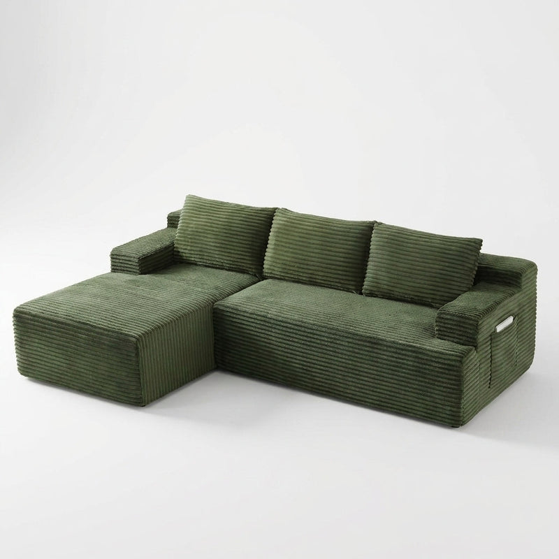 Green corduroy sectional sofa on a seamless studio background