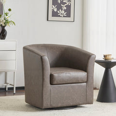 Dark brown faux leather swivel barrel chair in a sitting area