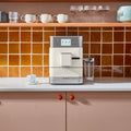 Angle | KitchenAid KF7 espresso machine lifestyle view on kitchen counter with cups