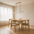 Scale | brushed nickel pendant shown against a full-height dining-room window