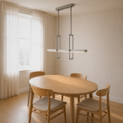 Dining room angle | brushed nickel pendant over a round oak table from three-quarter view