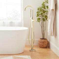 Lexia Floor Mounted Tub Filler Faucet and Valve with Stops in Polished Brass | product photo