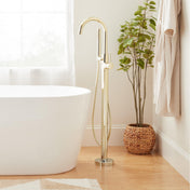 Lexia Floor Mounted Tub Filler Faucet and Valve with Stops in Polished Brass