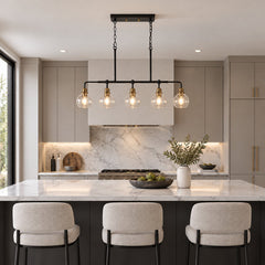 5-Light Linear Pendant Light with Seeded Glass Shades in Matte Black and Brass