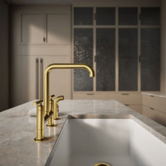 Kohler Purist Two Handle Deck-Mounted Bridge Kitchen Sink Faucet with Side Spray in Vibrant Brushed Moderne Brass | product photo