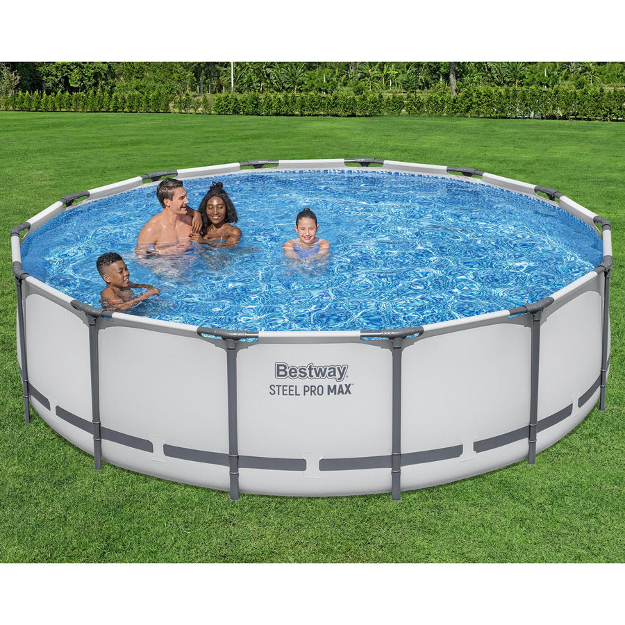 Backyard | Family swimming in the filled gray round pool on a lawn