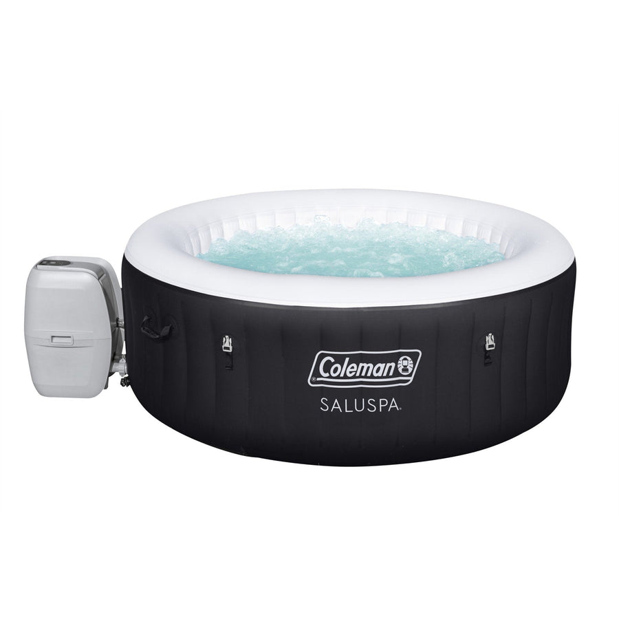 Filled | Round black hot tub filled with water, cover off, white interior visible