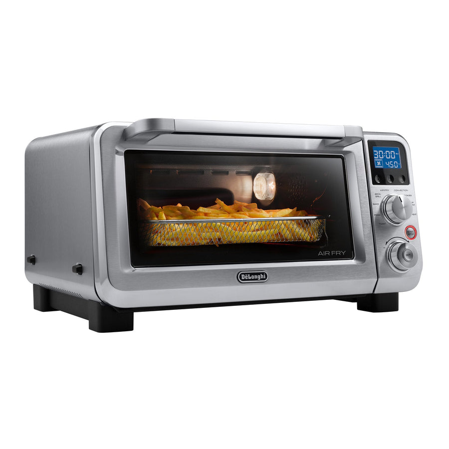 In Use | Three-quarter view with fries air frying in the basket, interior light on