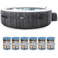 Front | Round Greywood spa with bubbling water, side pump, and six Type S1 filter cartridges on white