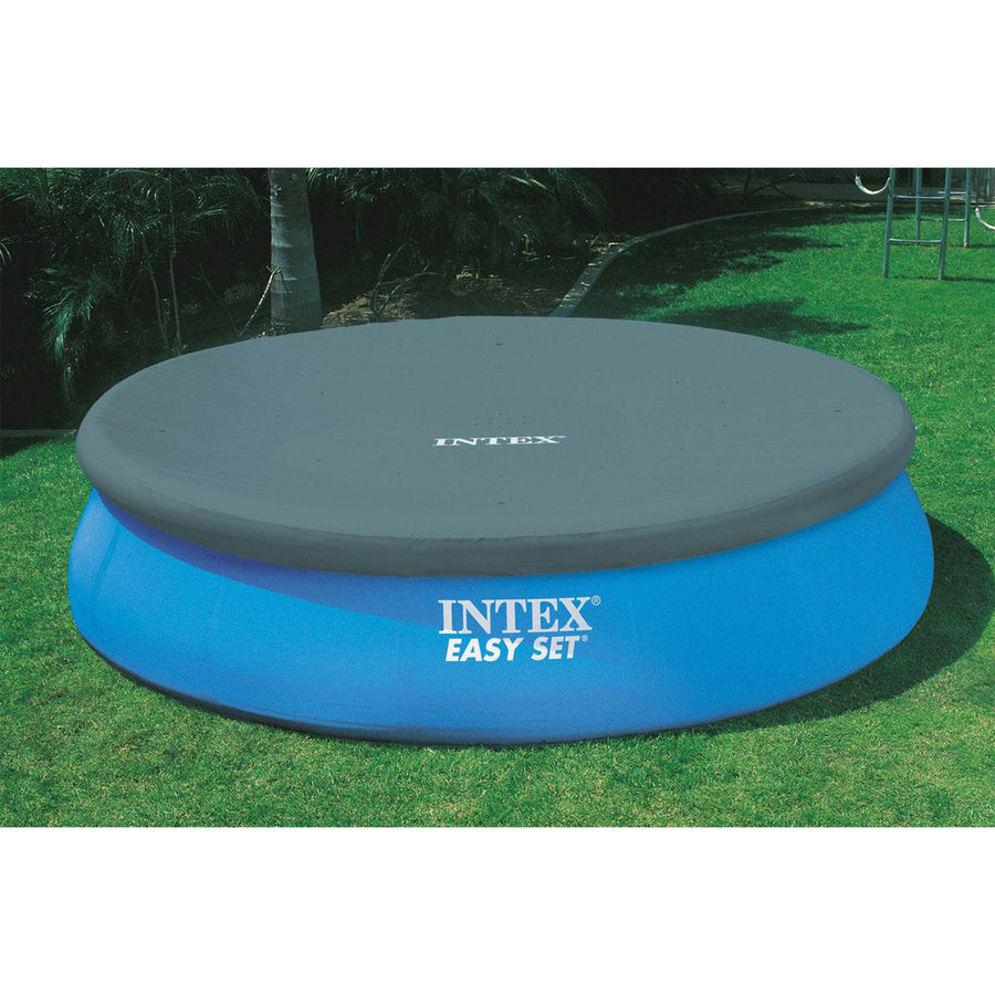 Cover | Dark gray debris cover on the filled pool with the ladder at the side