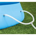 Hoses | Dual white filter hoses clamped to the light blue pool wall on a Y junction