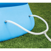 Hoses | Dual white filter hoses clamped to the light blue pool wall on a Y junction