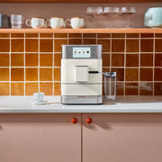 Lifestyle | KitchenAid KF8 espresso machine on kitchen counter with cups