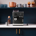 Lifestyle | KitchenAid semi-automatic espresso machine with the steam wand frothing milk