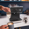 Lifestyle | KitchenAid semi-automatic espresso machine brewing espresso into a glass cup