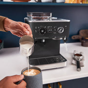 Lifestyle | KitchenAid semi-automatic espresso machine brewing espresso into a glass cup