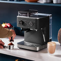 Lifestyle | KitchenAid semi-automatic espresso machine on a kitchen counter with coffee accessories