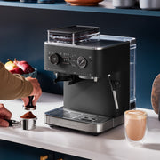 Lifestyle | KitchenAid semi-automatic espresso machine on a kitchen counter with coffee accessories