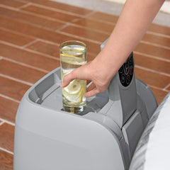 Cup holder | Glass of lemon water resting in the pump's built-in drink holder