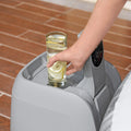 Cup holder | Glass of lemon water resting in the pump's built-in drink holder