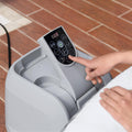 Detail | Hand pressing the digital temperature control on the pump housing