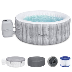 Front | Covered gray woodgrain hot tub with bubbling water and included accessories on a white background