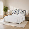 Airy corner | Corner bedroom view showing the headboard with bedding, rug, and dark flooring