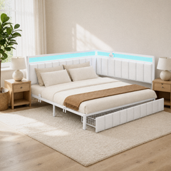 Room 2 | Corner bed in a bright bedroom with light bedding, wood nightstands, and drawers beneath