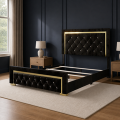 Studio angle | Black velvet-like upholstery, tufted panels, gold trim, and matching footboard