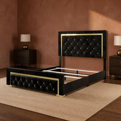 Room 1 angle | Black tufted panel bed with gold trim and exposed slat opening