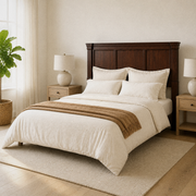 Airy corner | Angled airy bedroom view showing the headboard and bed length with nightstand and lamp