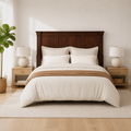 Airy room | Centered headboard in a bright bedroom with oak nightstands, plant, rug and soft window light