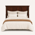 Front | Straight-on studio view of the complete rectangular wood headboard with panel details and crown molding