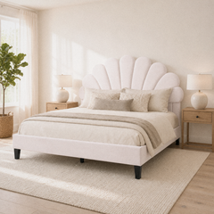 Room 2 angle | Three-quarter view with a window, plant, nightstands, and rug
