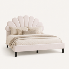 Studio angle | Three-quarter studio view of the arched headboard, frame, and tapered legs