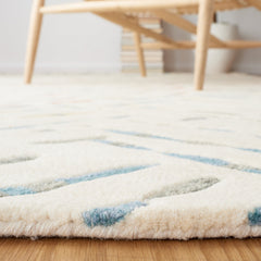 Area Rug, 6 ft by 9 ft, Ivory and Blue Wool with Abstract Pattern