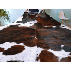 Area Rug with Cowhide Construction in Black, White, and Brown