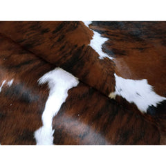 Area Rug with Cowhide Construction in Black, White, and Brown