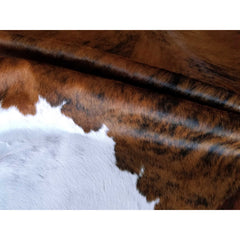 Area Rug with Cowhide Construction in Black, White, and Brown
