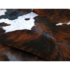 Area Rug with Cowhide Construction in Black, White, and Brown