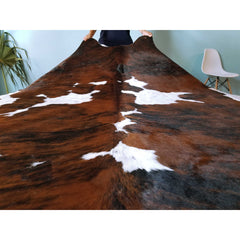 Area Rug with Cowhide Construction in Black, White, and Brown