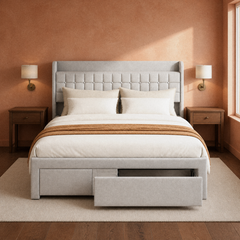 Room 3 | Front view of the gray tufted bed against a clay-toned wall with open drawers
