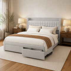 Room 1 angle | Three-quarter room view showing the gray upholstered frame, tufted headboard, and two open foot drawers
