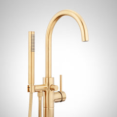 Lexia Floor Mounted Tub Filler Faucet with Hand Shower and Valve in Brushed Gold | detail photo