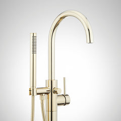 Lexia Floor Mounted Tub Filler Faucet and Valve with Stops in Polished Brass | detail photo