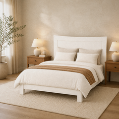 Room 1 angle | Three-quarter view of the white framed panel headboard with a window and nightstand