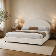 Room 1 angle | Three-quarter room view showing the rounded headboard and matching bedside tables