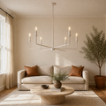 In a room | bisque-white six-arm chandelier hanging in a living room