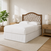 Airy corner | Corner view of the rattan headboard with bright window light and light wood furniture